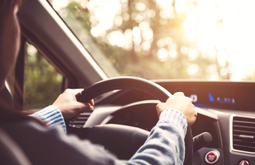 Hands on a steering wheel