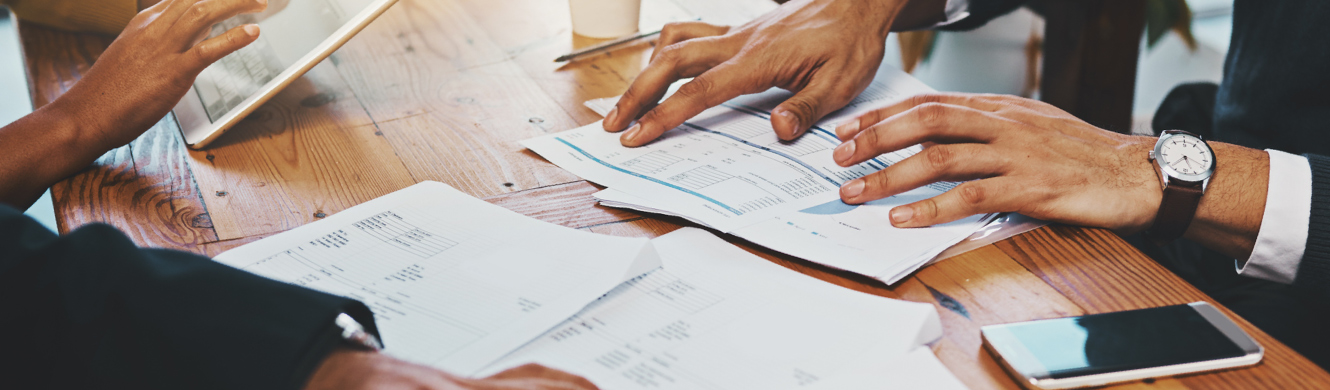 Documents and hands on table during meeting