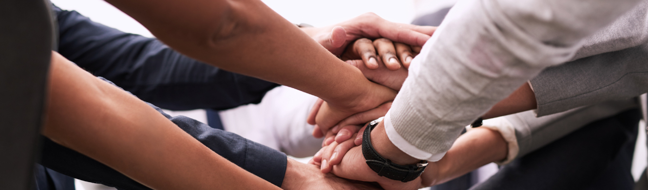 A team stacking hands