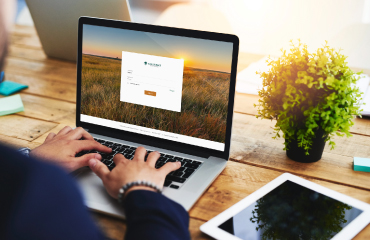 Hands using laptop for online banking